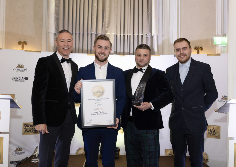 Centre left to right Kevin Pigott Global Winner Brand Ambassador Irish Whiskey of the Year and James Hutchinson Account Manager Mc Laren Packaging