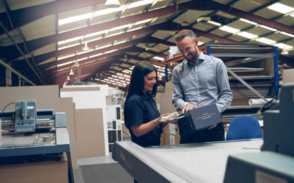 McLaren Packaging staff reviewing the packaging manufacturing